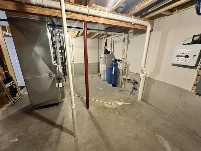 basement featuring water heater and heating unit