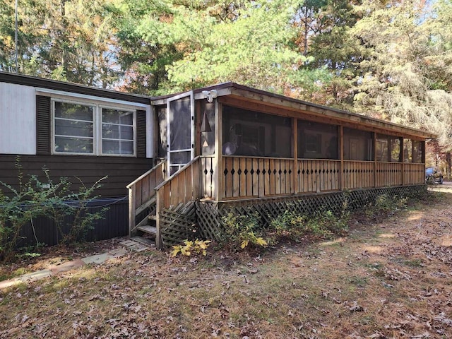 view of front of house featuring a sunroom