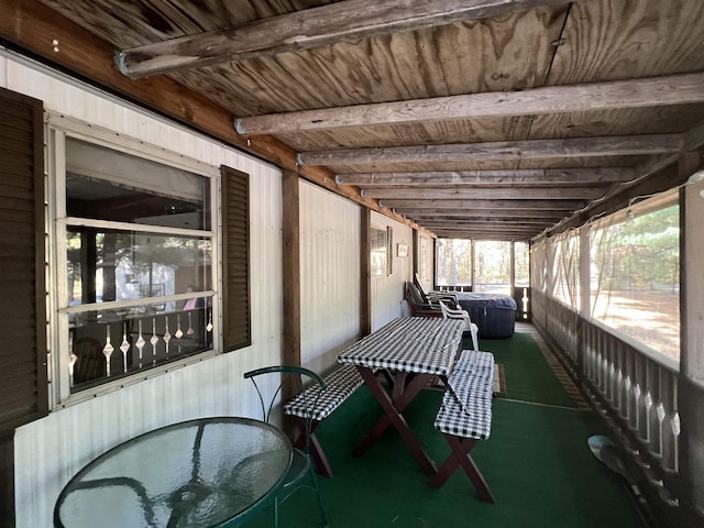 sunroom with beam ceiling