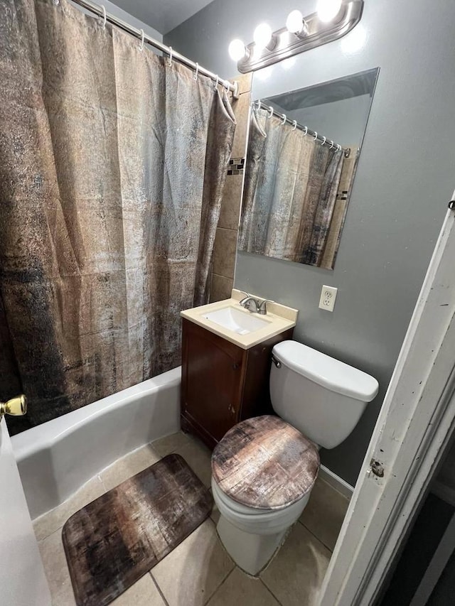 full bathroom with vanity, tile patterned floors, toilet, and shower / bathtub combination with curtain