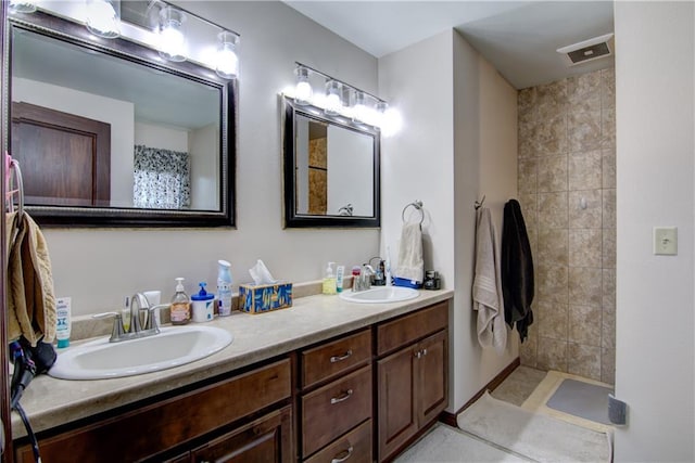 bathroom featuring vanity and tile patterned flooring