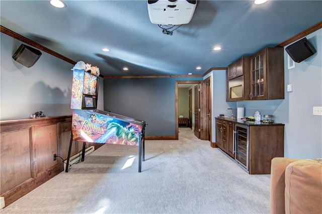 bar with wine cooler, ornamental molding, light carpet, and dark brown cabinetry