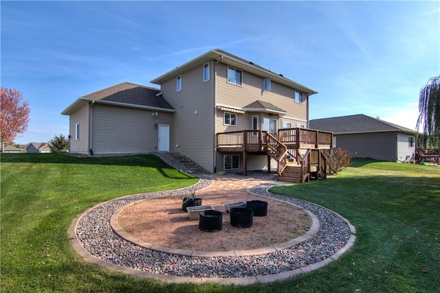 back of house featuring a patio area, a deck, and a yard