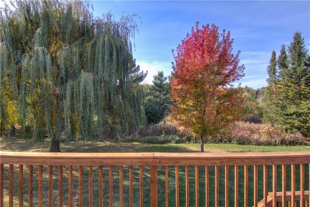 deck featuring a lawn