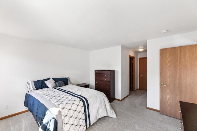 bedroom with light colored carpet