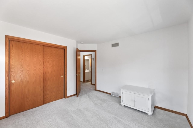 carpeted bedroom featuring a closet