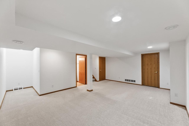 basement with light colored carpet