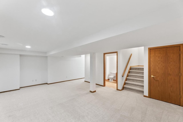 basement with light colored carpet