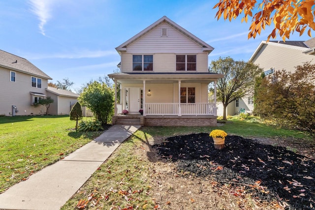 view of front facade with a front lawn and a porch