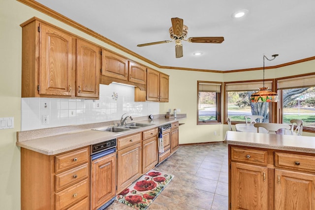 kitchen with a wealth of natural light, sink, and crown molding