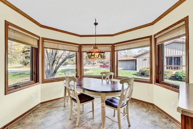 dining space featuring ornamental molding