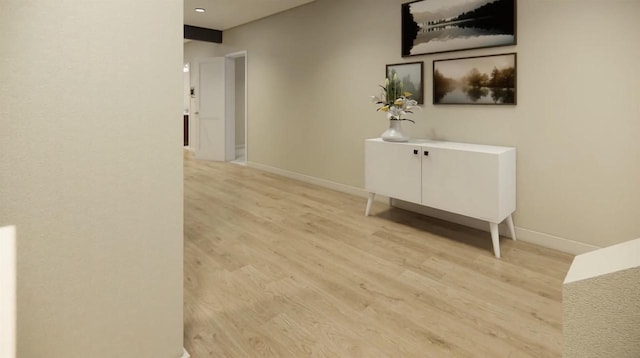 hallway with light hardwood / wood-style floors