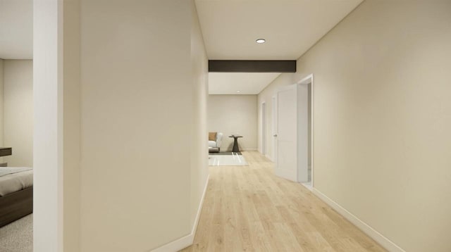 corridor with light hardwood / wood-style flooring