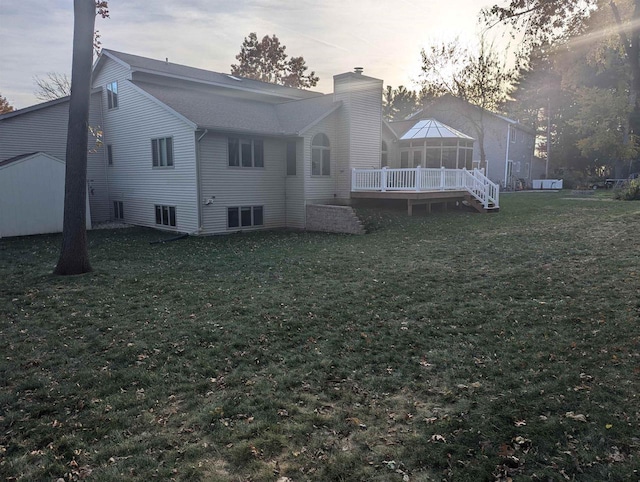 back house at dusk with a yard