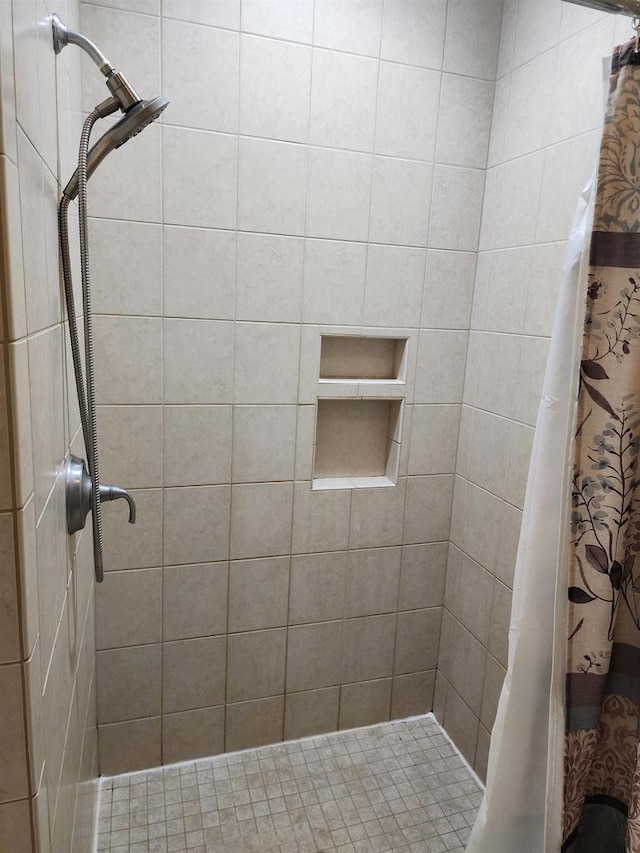 bathroom with a shower with shower curtain