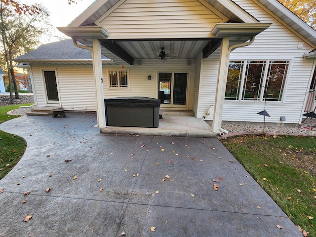 back of house with a hot tub, a patio area, and ceiling fan