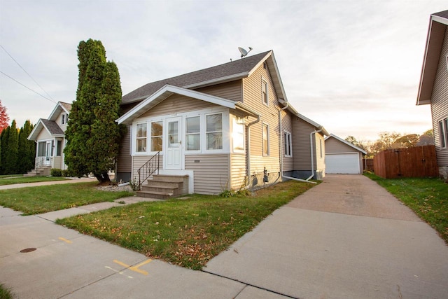 view of front of property with a front yard and a garage