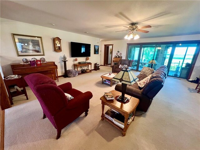 living room featuring ceiling fan and carpet floors