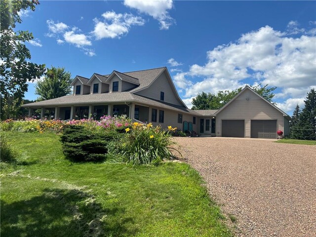 view of front of property with a front lawn and a garage