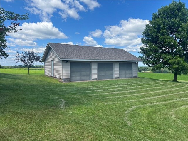 garage featuring a yard