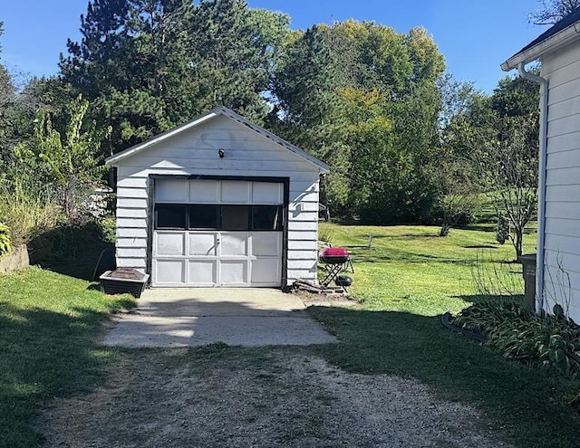 garage featuring a yard