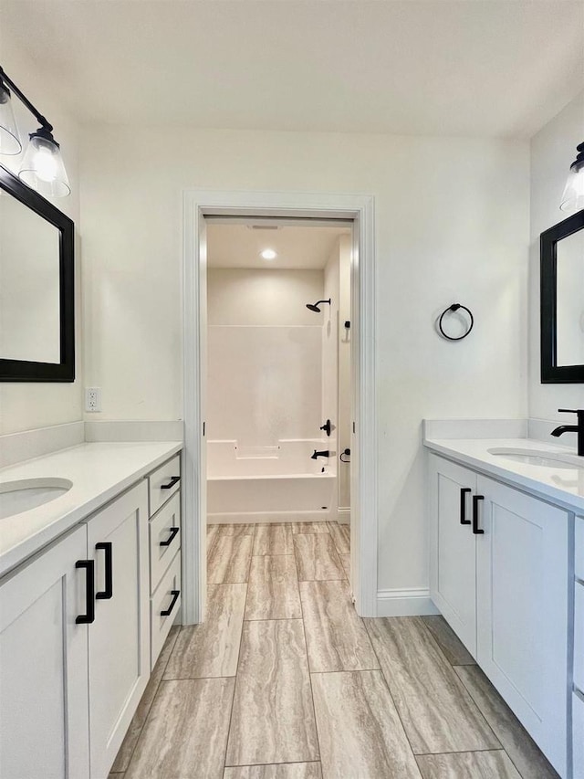 bathroom with vanity and washtub / shower combination