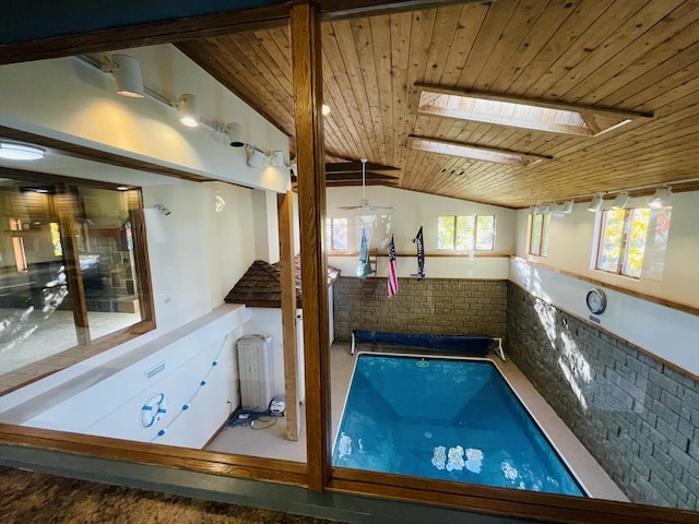 view of pool with a skylight