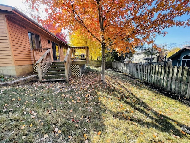 view of yard featuring a wooden deck