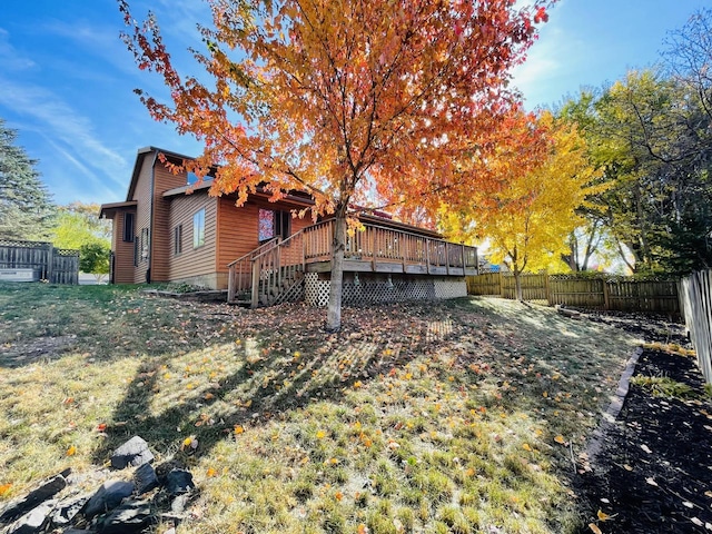 rear view of house featuring a deck