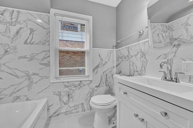 bathroom featuring tile walls, vanity, toilet, and a bath