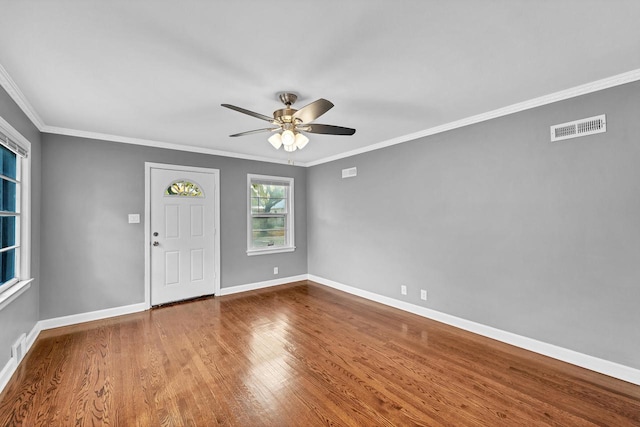 foyer entrance featuring ceiling fan, hardwood / wood-style flooring, and ornamental molding