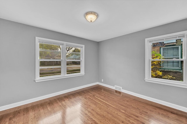 spare room featuring hardwood / wood-style flooring