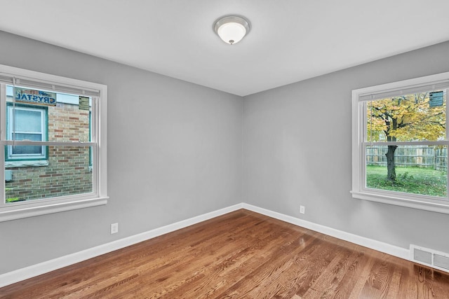 empty room featuring hardwood / wood-style floors