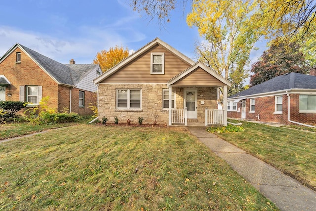 bungalow-style house featuring a porch and a front lawn