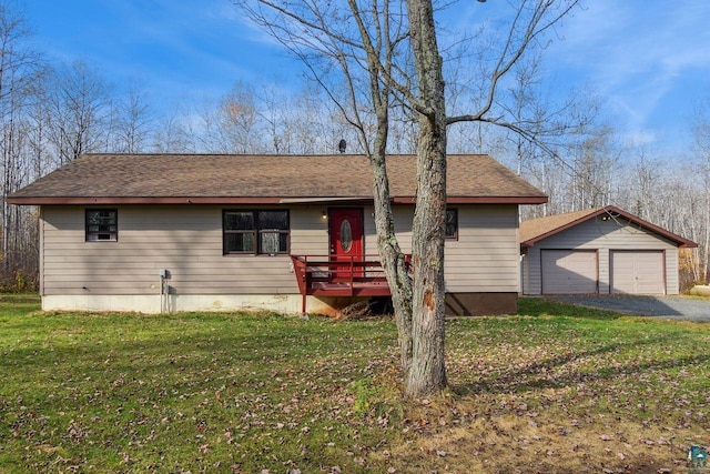 view of front facade with a front yard, an outdoor structure, a garage, and a deck