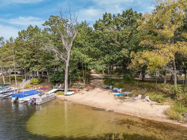 view of home's community with a water view