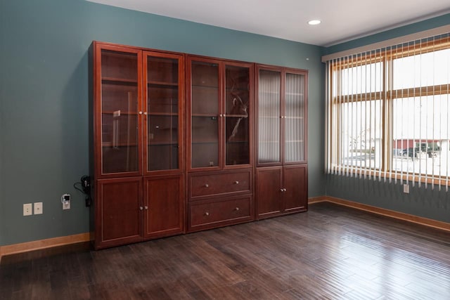 spare room featuring dark hardwood / wood-style floors