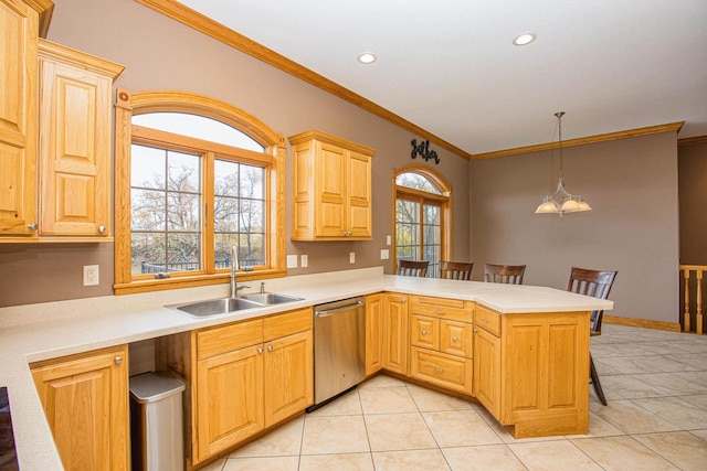 kitchen with a breakfast bar area, stainless steel dishwasher, sink, and kitchen peninsula