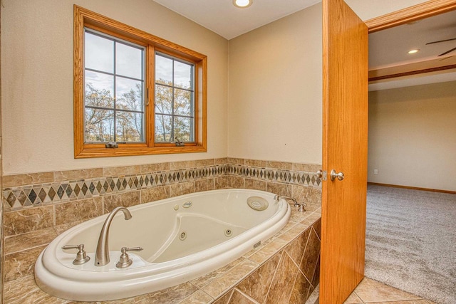 bathroom featuring tile patterned floors and a relaxing tiled tub