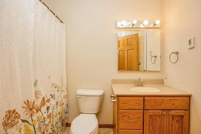 bathroom featuring toilet, a shower with curtain, vanity, and tile patterned floors