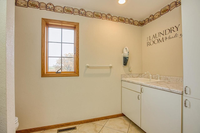 bathroom featuring vanity, toilet, and tile patterned floors