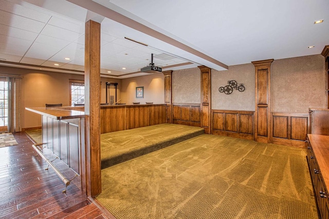 interior space with wood walls and dark hardwood / wood-style flooring