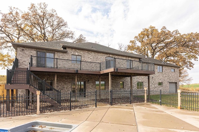 rear view of property with a deck