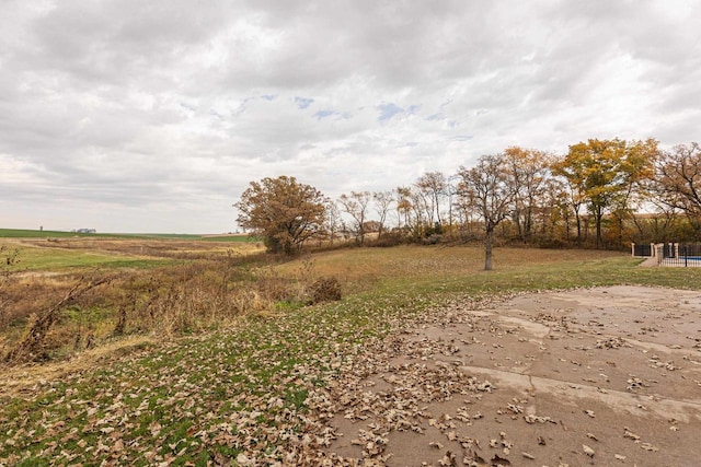 view of yard with a rural view