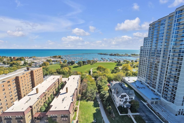 birds eye view of property with a water view