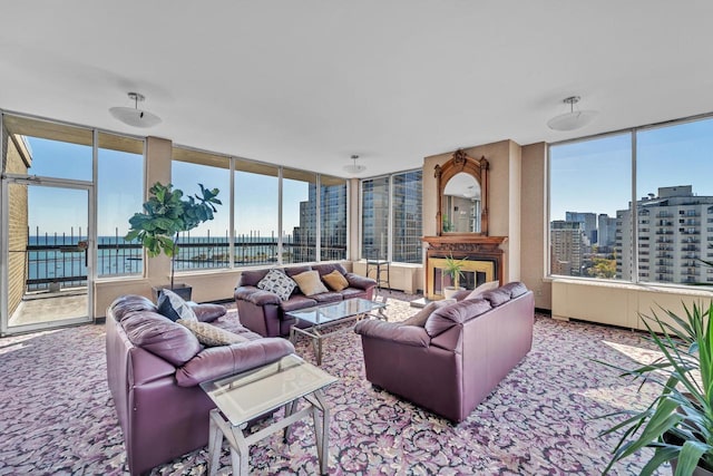 carpeted living area featuring a view of city
