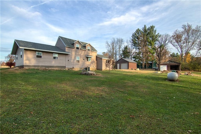 view of yard with an outbuilding and a garage