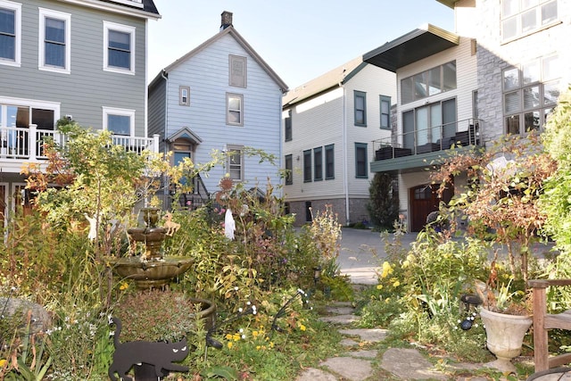 back of property with a balcony