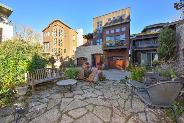 view of patio featuring a balcony