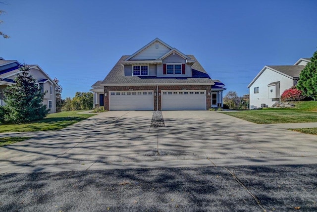 view of front facade with a front lawn and a garage